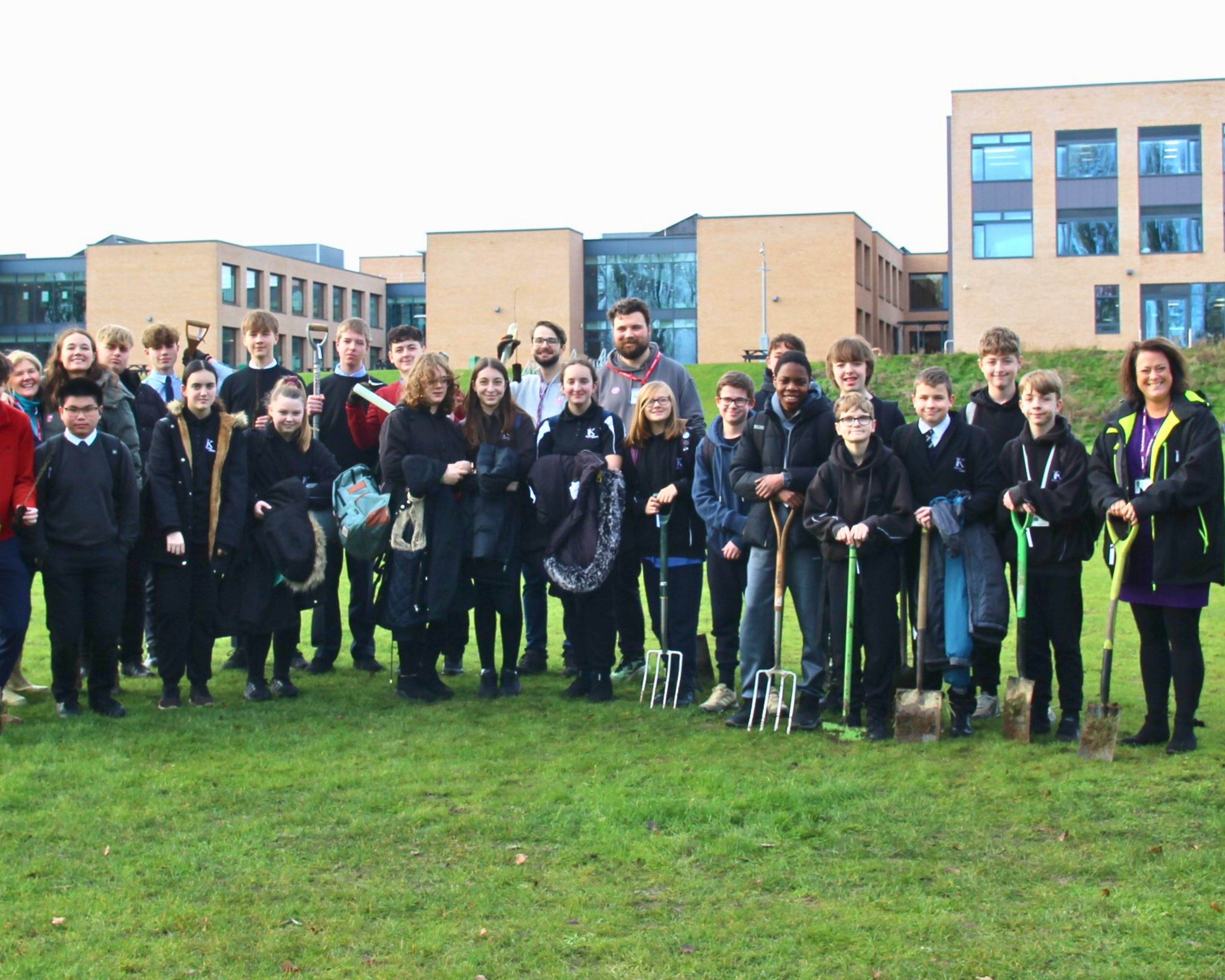 Photo for our Project Initiatives page, showing a photo from our tree planting session with Brooke Weston Trust