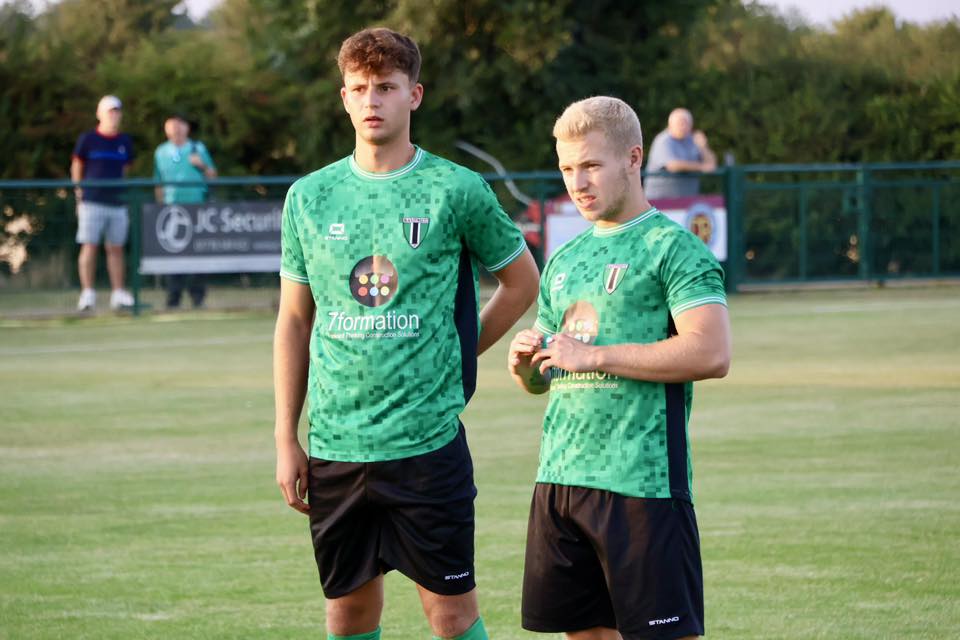 Photo showing 2 players from Blackstones FC, wearing shirts sponsored by 7formation